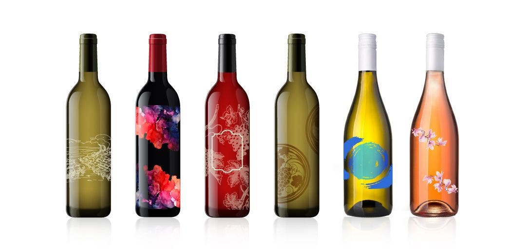 6 bottles ranging from green, yellow, to red colored wine bottles with unique designs on each one.